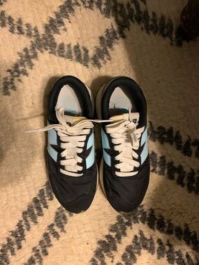 New Balance Black Sneakers with Light Blue Accents
